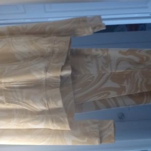Im selling a jogging suit with a hood and jacket juicy couture cream with swirls